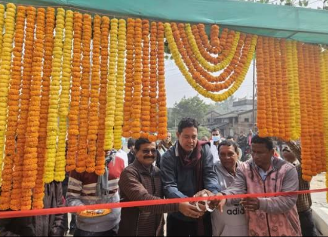 Ribbon-cutting on clinic inauguration day under floral decoration